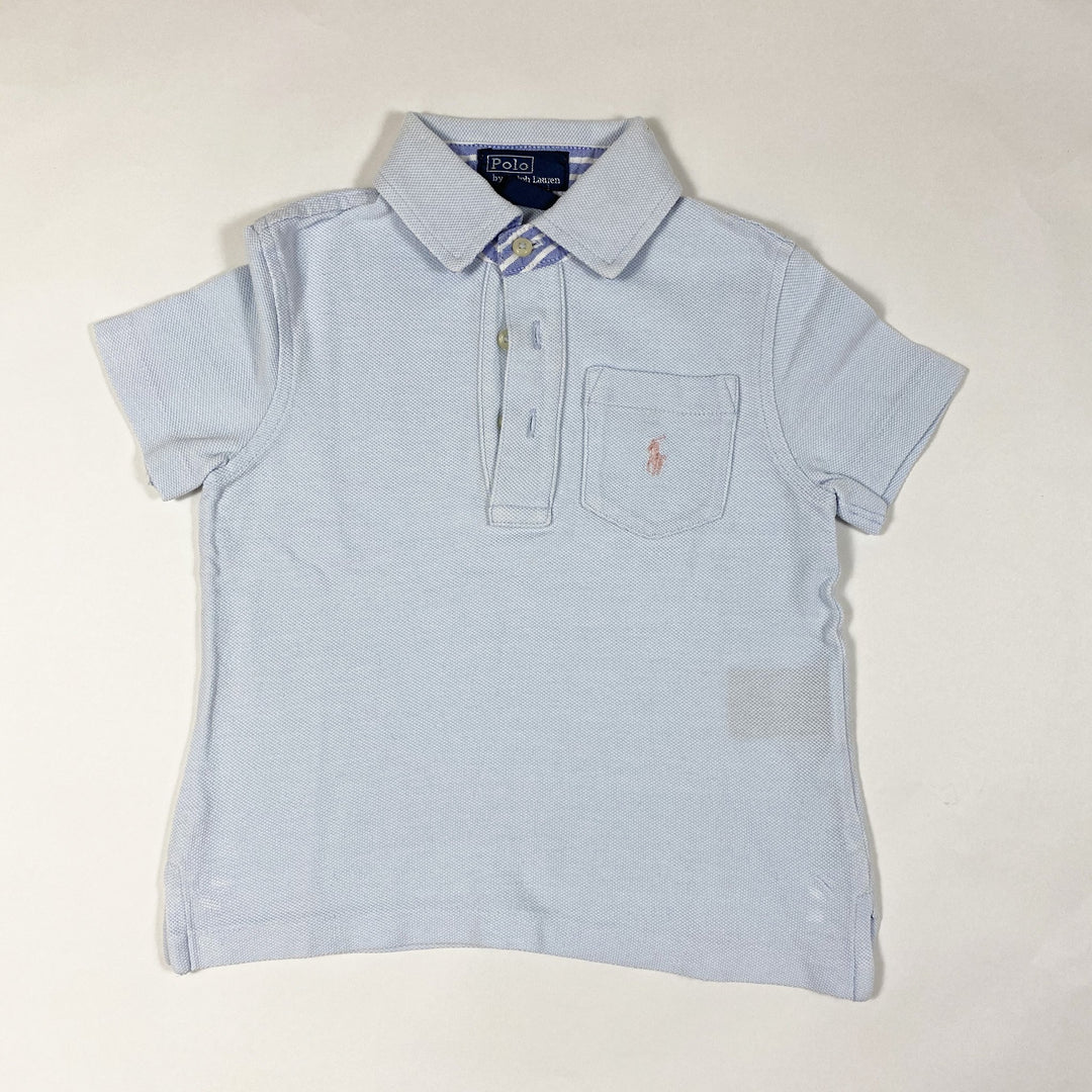 Ralph Lauren light blue short-sleeved polo shirt with oxford stripe detailing on collar 2Y