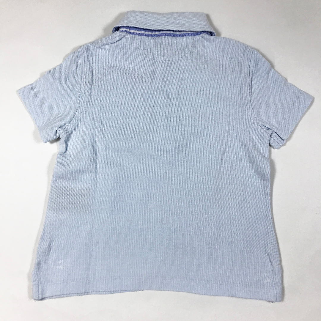 Ralph Lauren light blue short-sleeved polo shirt with oxford stripe detailing on collar 2Y